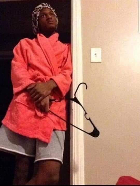 mom holding a hanger.JPG